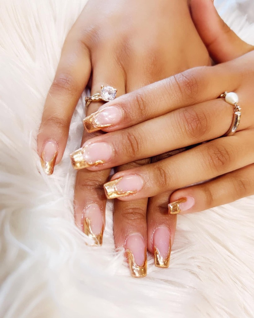 Custom nail art with floral and glitter accents