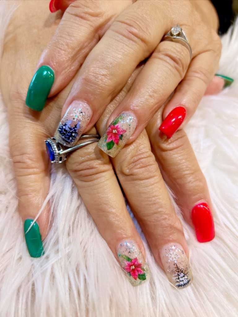 Hand-painted nail art with glitter accents