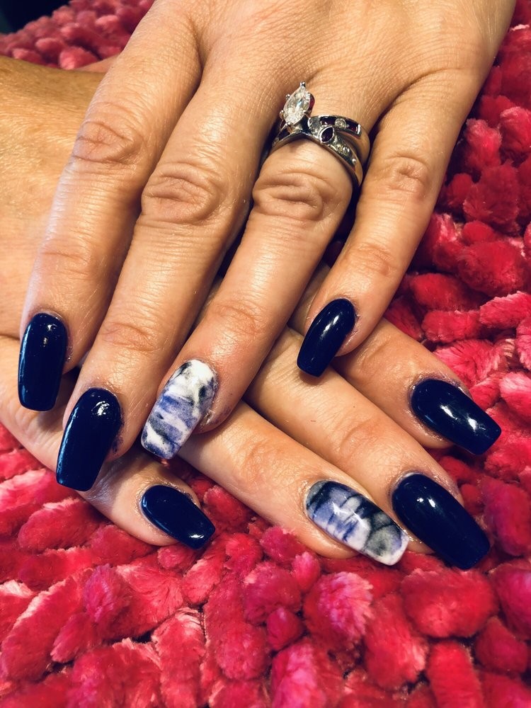White and glitter statement nails with bling