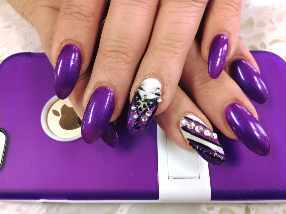 Glossy manicure featuring hand-painted designs